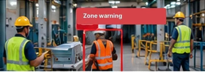 A worker inside a restricted zone on a factory floor, flagged with a zone warning
