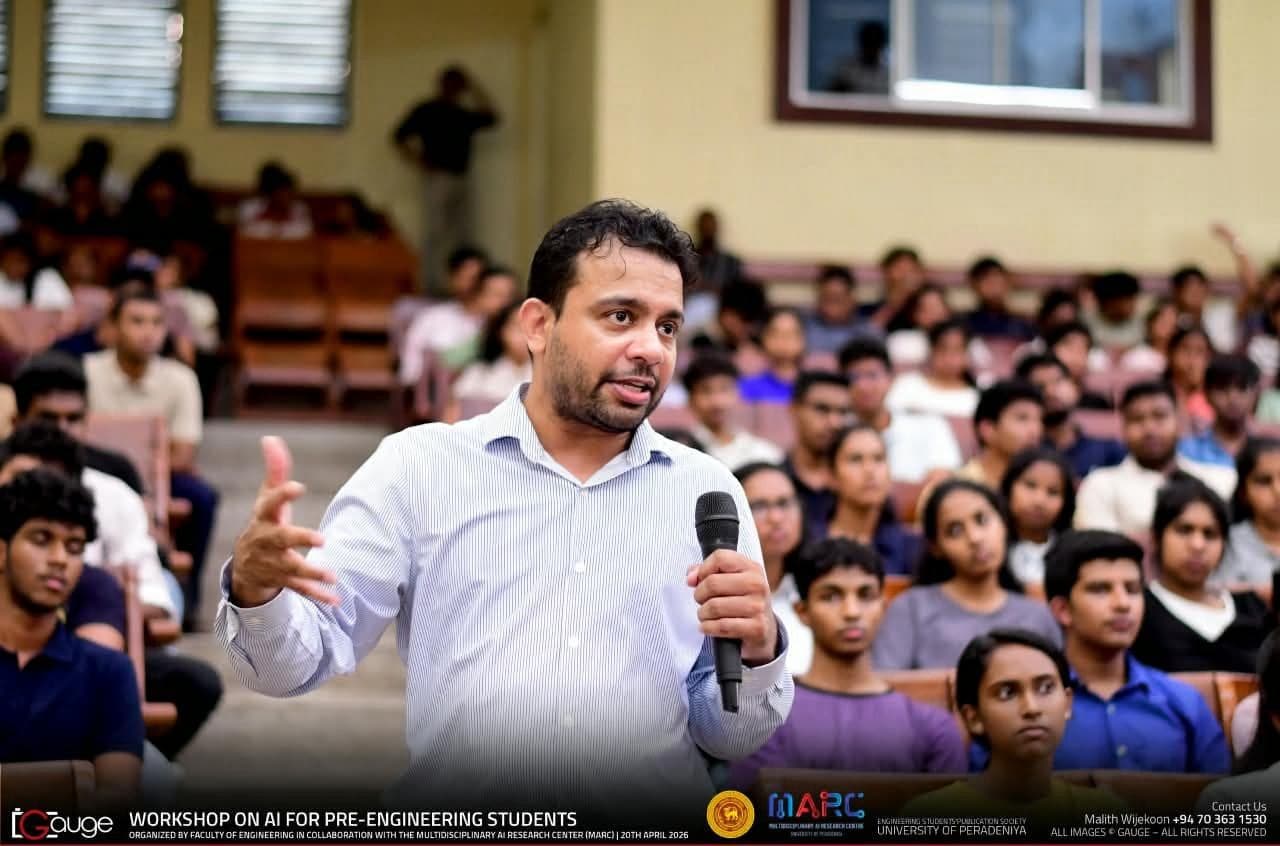 A FARBE instructor leading an AI workshop in a packed lecture hall
